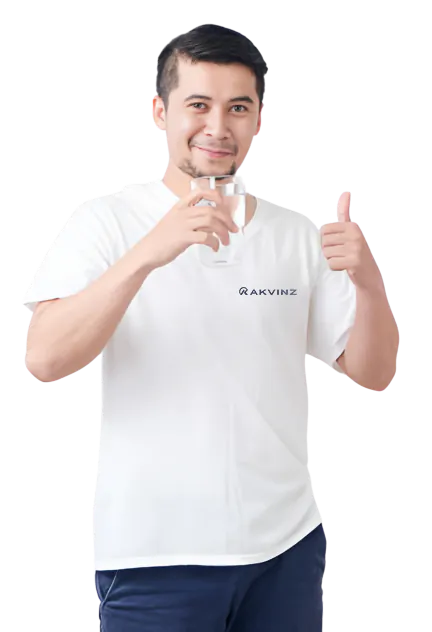 Man giving a thumbs up while drinking alkaline water